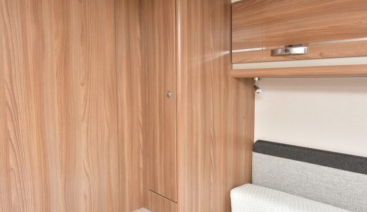 The island bed is flanked by wardrobes, which both have two drawers