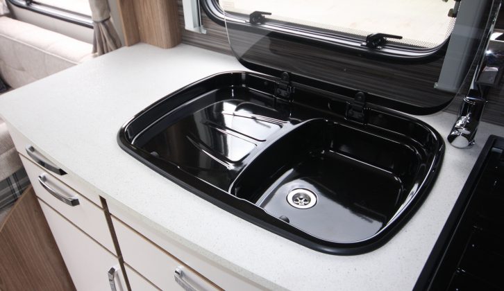 The fixed sink/drainer in the kitchen means food preparation space is compromised, however a dual-fuel hob, a separate oven and grill, and a microwave are fitted