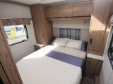 The 2016 Coachman Laser 650's 1.82m x 1.37m island bed is flanked by wardrobes
