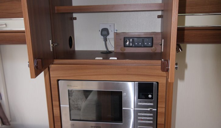 There's also a useful amount of extra storage above and below the microwave