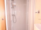 There's a fully lined shower cubicle on the Elddis Affinity 530's offside