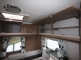 Three cupboards in the van's rear lounge have shelving to help you organise your touring kit