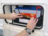 One option you have when storing your tourer is to keep the leisure battery in what is, essentially, its secure storage box in the caravan