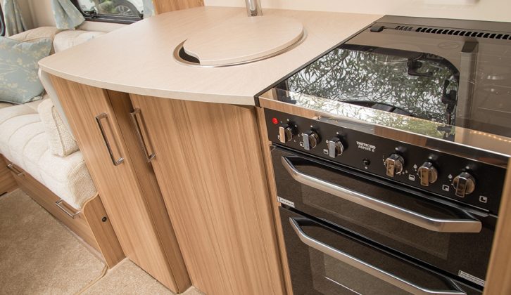 The kitchen has good storage, a separate oven and grill, three gas burners and an electric hotplate