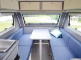 There are plenty of overhead lockers, a dining table that supports the double bed and windows that open