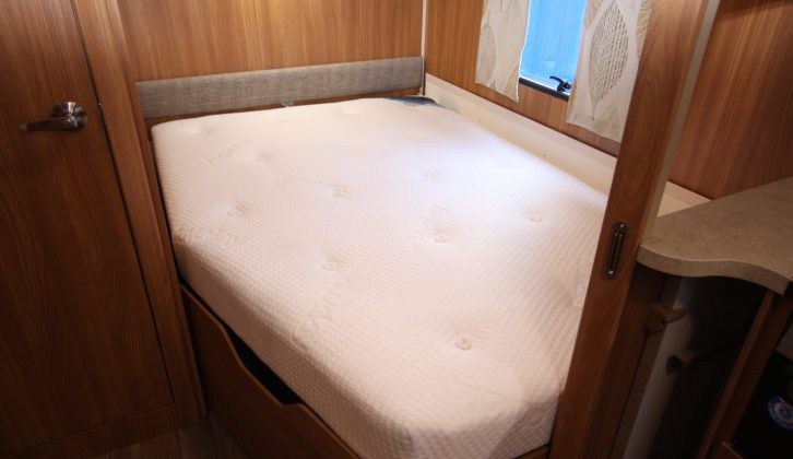 The fixed bed has a Duvalay Duvalite mattress and shelves on which to perch a cuppa