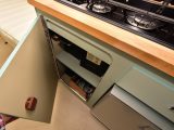 A cupboard, shelves and two overhead lockers feature in the kitchen, as well as a 65-litre fridge-freezer that runs on 12V or mains power