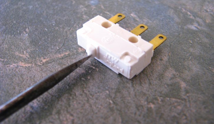 The actual microswitch on the new part is indicated above. Be aware of its location