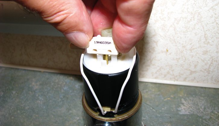 Slide the wires’ connectors onto the spade terminals of the microswitch and fit in place