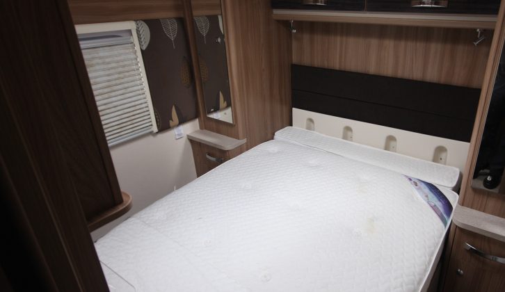 The retractable island bed is 1.82m x 1.33m, flanked by wardrobes – the Swift Conqueror 650 has a great rear bedroom