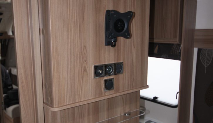 A TV point and bracket are mounted at the foot of the 650's bed