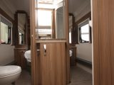 'His ‘n’ hers' sliding doors give access to the washroom from either side of the island bed, plus there's a door from the kitchen