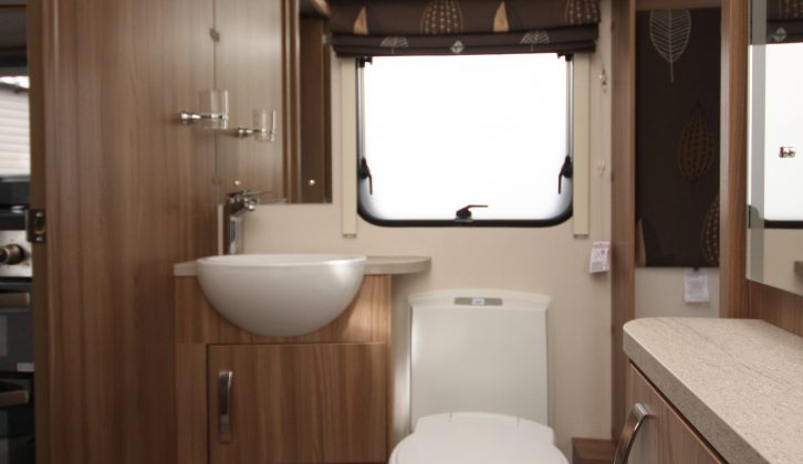 There's an electric flush toilet in the twin-axle 650's central washroom