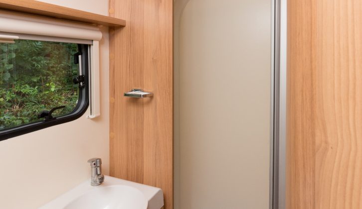 The shower's bifold door is a well thought out, space-saving design feature