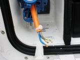 Trim the orange sheath and the blue/green wires to length, then secure with a cable-tie