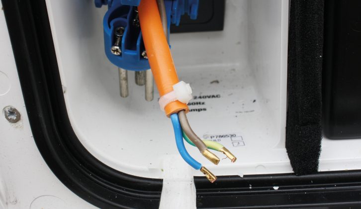 Trim the orange sheath and the blue/green wires to length, then secure with a cable-tie