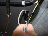Find a service hole in the floor away from heat sources, and attach the sensor nearby