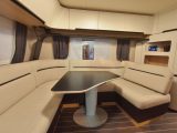 Overhead lockers mean there's plenty of storage, the yacht-style seating and timber flooring design come straight from the Caravisio, and a sound system is mounted in the open lockers in this rear lounge