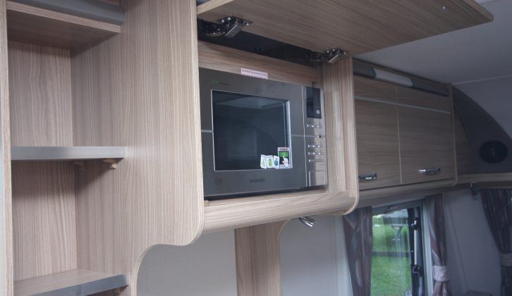 The microwave is located on the nearside wall in its own cupboard, but might be set too high for some caravanners