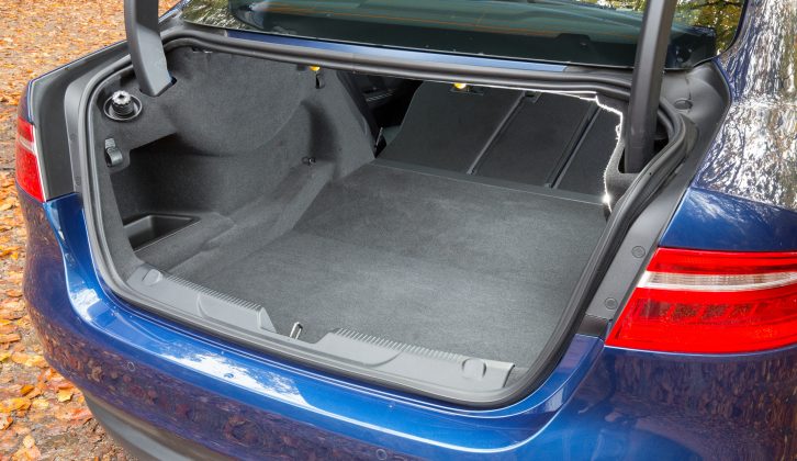 The Jaguar XE's rear seats fold to increase boot capacity