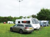 Kessingland Camping & Caravanning Club site's spacious grass pitches are overshadowed by two wind turbines