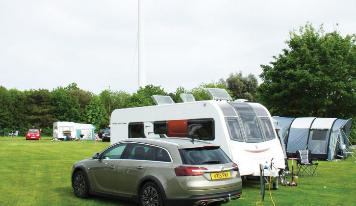 Kessingland Camping & Caravanning Club site's spacious grass pitches are overshadowed by two wind turbines