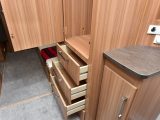 The caravan's wardrobe has a good hanging depth, plus drawers and a small shoe cupboard