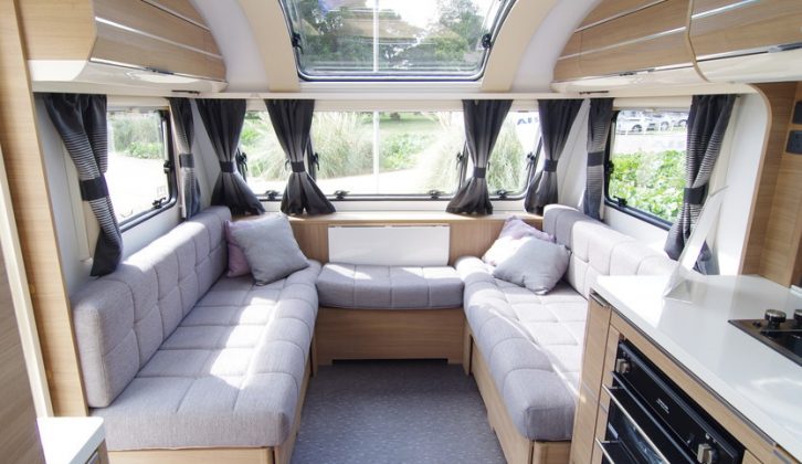 The front windows and opening panoramic rooflight make the lounge feel light and spacious in the Adria Adora Isonzo 613DT