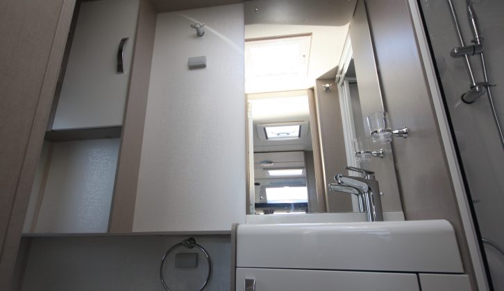 Floor space may be compromised in the washroom, but it has a host of storage options