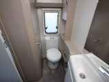 Space around the Thetford electric flush toilet is pretty tight in this van's washroom