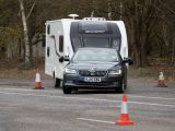 The Škoda Superb was undeterred by the wet test track, exhibiting precise steering, ample grip and sure control of the caravan in our lane-change test
