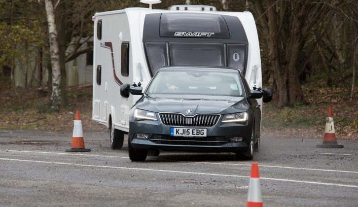 The Škoda Superb was undeterred by the wet test track, exhibiting precise steering, ample grip and sure control of the caravan in our lane-change test