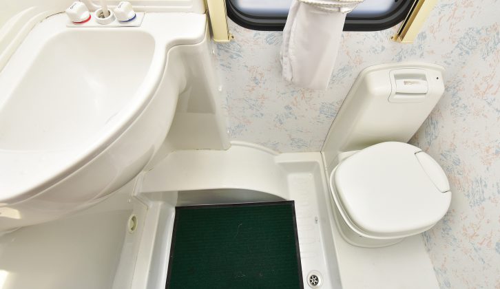 The central washroom in the Compass Rambler 17/5 had an ABS shower and sink, plus a manual-flush toilet
