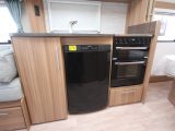 The 574's kitchen features a Thetford Aspire 2 dual-fuel hob with separate oven and grill, as well as a Dometic fridge/freezer