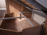 There's a lot of storage space under the fixed bed, plus it can be accessed from outside the van