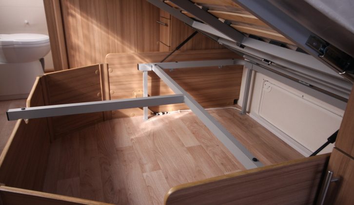 There's a lot of storage space under the fixed bed, plus it can be accessed from outside the van
