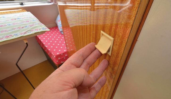 The wardrobe's pull-out plastic catch was innovative in 1971, and it still works now!