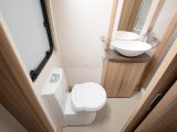 The vanity unit features an attractive designer basin and there's a Thetford electric-flush loo