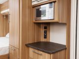 Opposite the kitchen is this dresser, with an extra worktop, drawer, cupboard and a microwave above