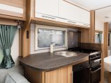 The Lunar Quasar 574's light, airy kitchen has a good worktop space beside the sink as well as on the dresser opposite