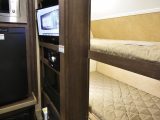 The American R-pod RP-176 caravan has fixed bunk beds, measuring 1.88m x 0.54m