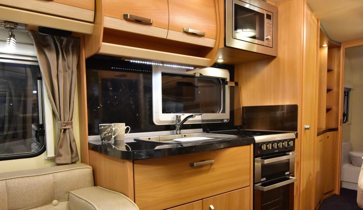 The 560 has a well-lit and well-appointed kitchen, although we'd rather not have the microwave sited over the hob