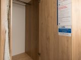 This wardrobe is located between the side dinette and the washroom in the Xplore 586