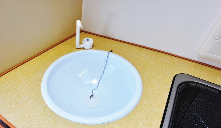 The Go-Pod's circular plastic sink has a cold water tap only and no glass lid