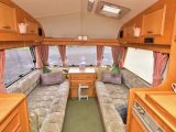 Handbuilt furniture gives the Castleton HL Roadster caravan's front lounge a luxury look
