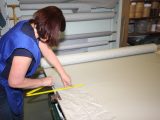 The original awning section is used as a template for marking and cutting a new panel
