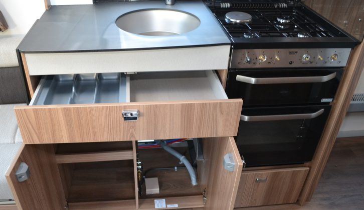The 580's kitchen has a handy cutlery drawer with a good-sized cupboard beneath