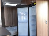 The slim-line Dometic fridge-freezer is located opposite the main kitchen area
