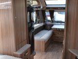 Half-length wardrobes flank the 1.82m x 1.33m transverse island bed – read more in the Practical Caravan Swift Conqueror 580 review
