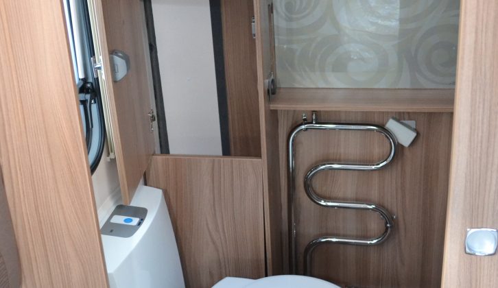 Enter the washroom via a sliding door and you'll find a heated towel rail next to the electric-flush, swivel toilet